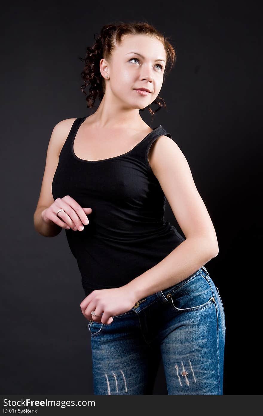 Dancing girl against a dark background. Dancing girl against a dark background