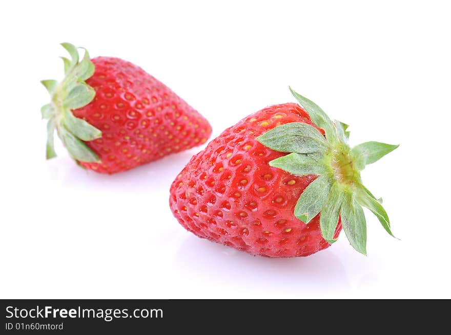 Two strawberries isolated on white background