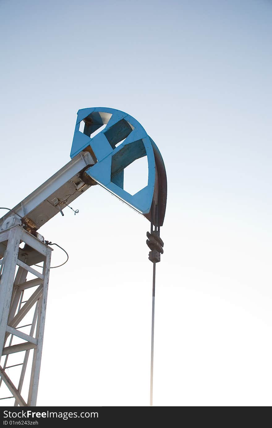 Oil pump on a background blue sky