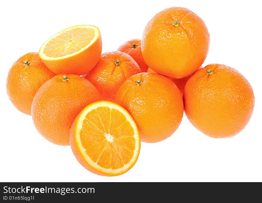 Bunch of Fresh oranges. One cut on half. Isolated on white background.