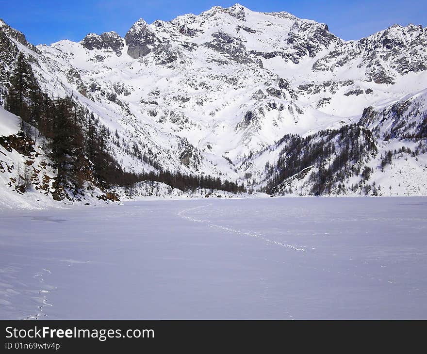 Walking on ice crust of a lake in winter. Walking on ice crust of a lake in winter