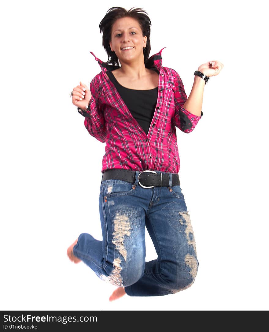 Portrait of a young woman wearing a pink shirt and ripped blue jeans. She is jumping in the air. Slight motion bluriness is intended. Portrait of a young woman wearing a pink shirt and ripped blue jeans. She is jumping in the air. Slight motion bluriness is intended.