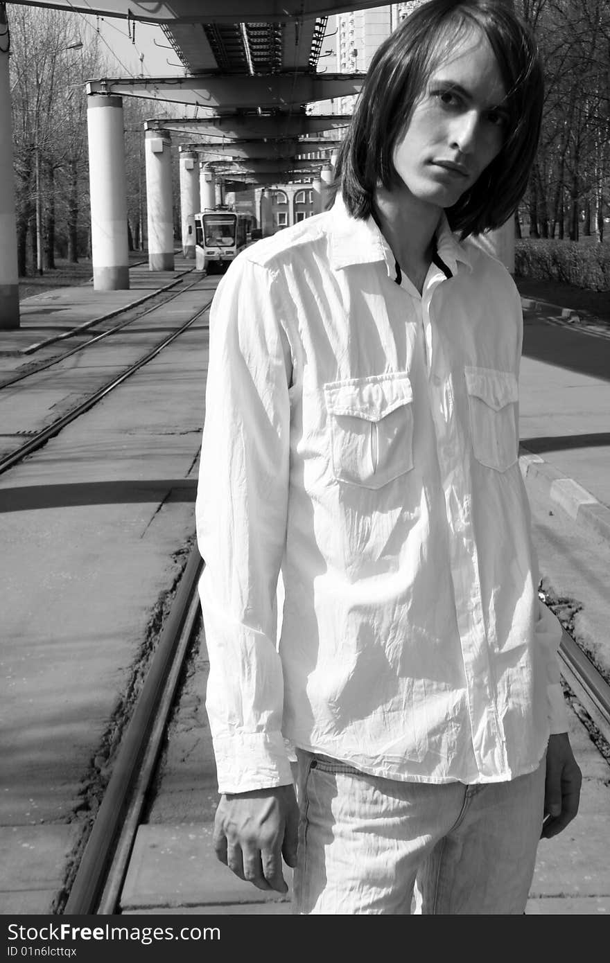 Man standing on tramway outdoor