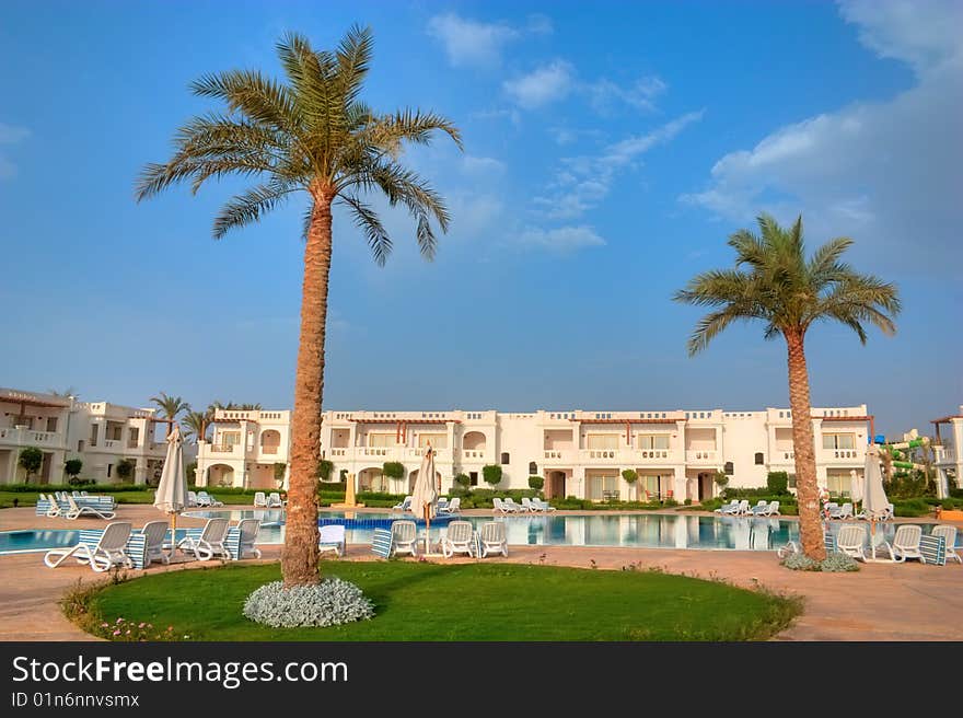 Swimming pool with blue water in tropical hotel. Swimming pool with blue water in tropical hotel