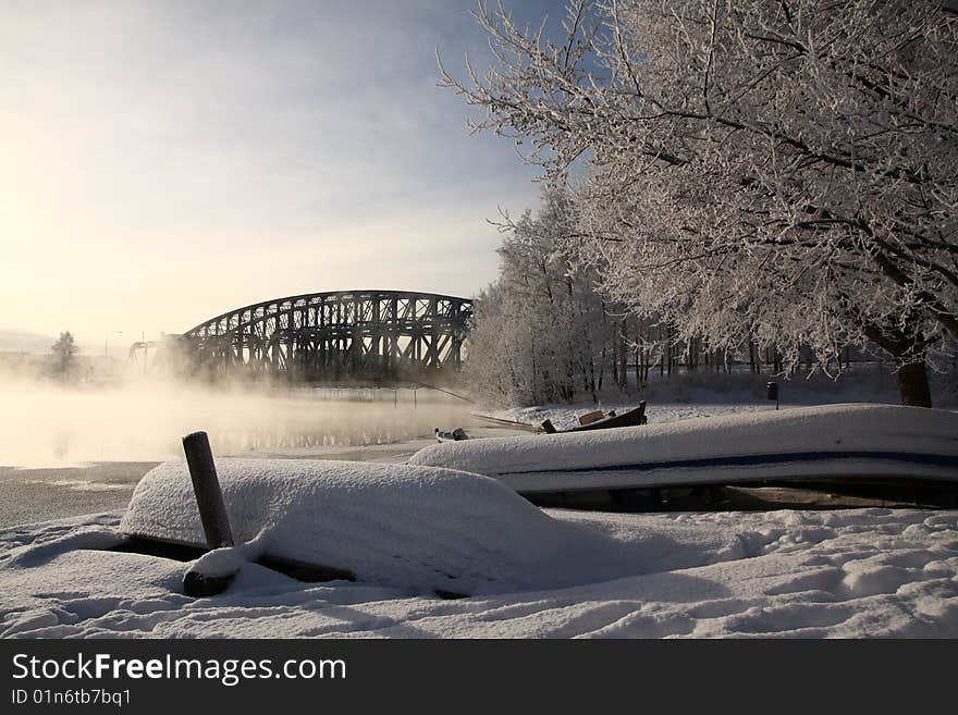 Very cold day, view over a river and bridge