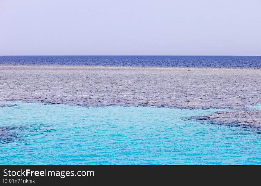 Coral island in the turquoise sea. Coral island in the turquoise sea