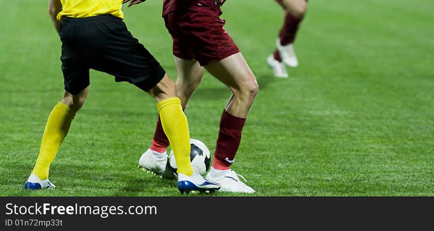 Soccer players fighting the ball