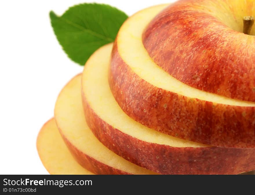 Red cut apple with leaves