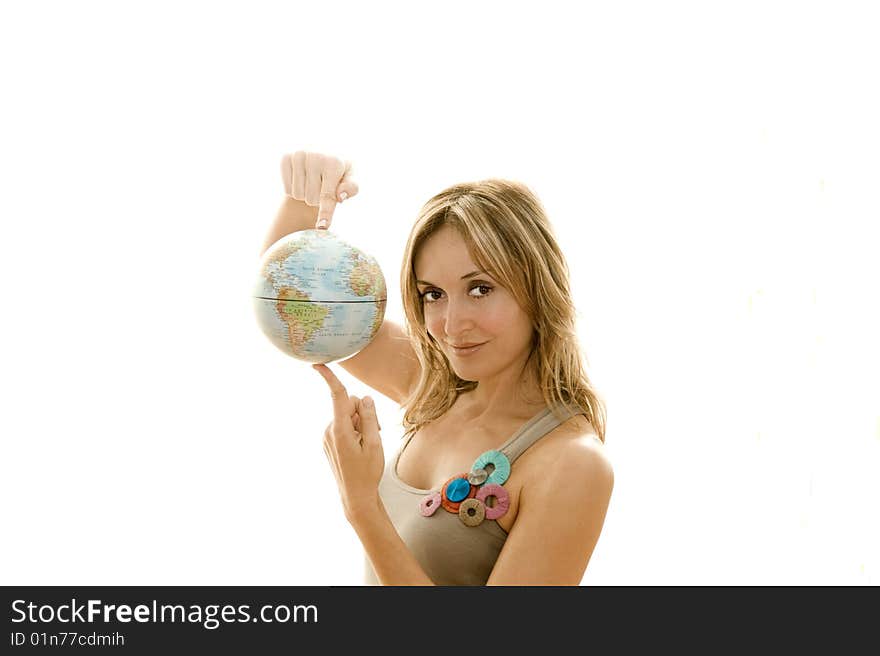 Young woman holding a small globe in her hand. Young woman holding a small globe in her hand.