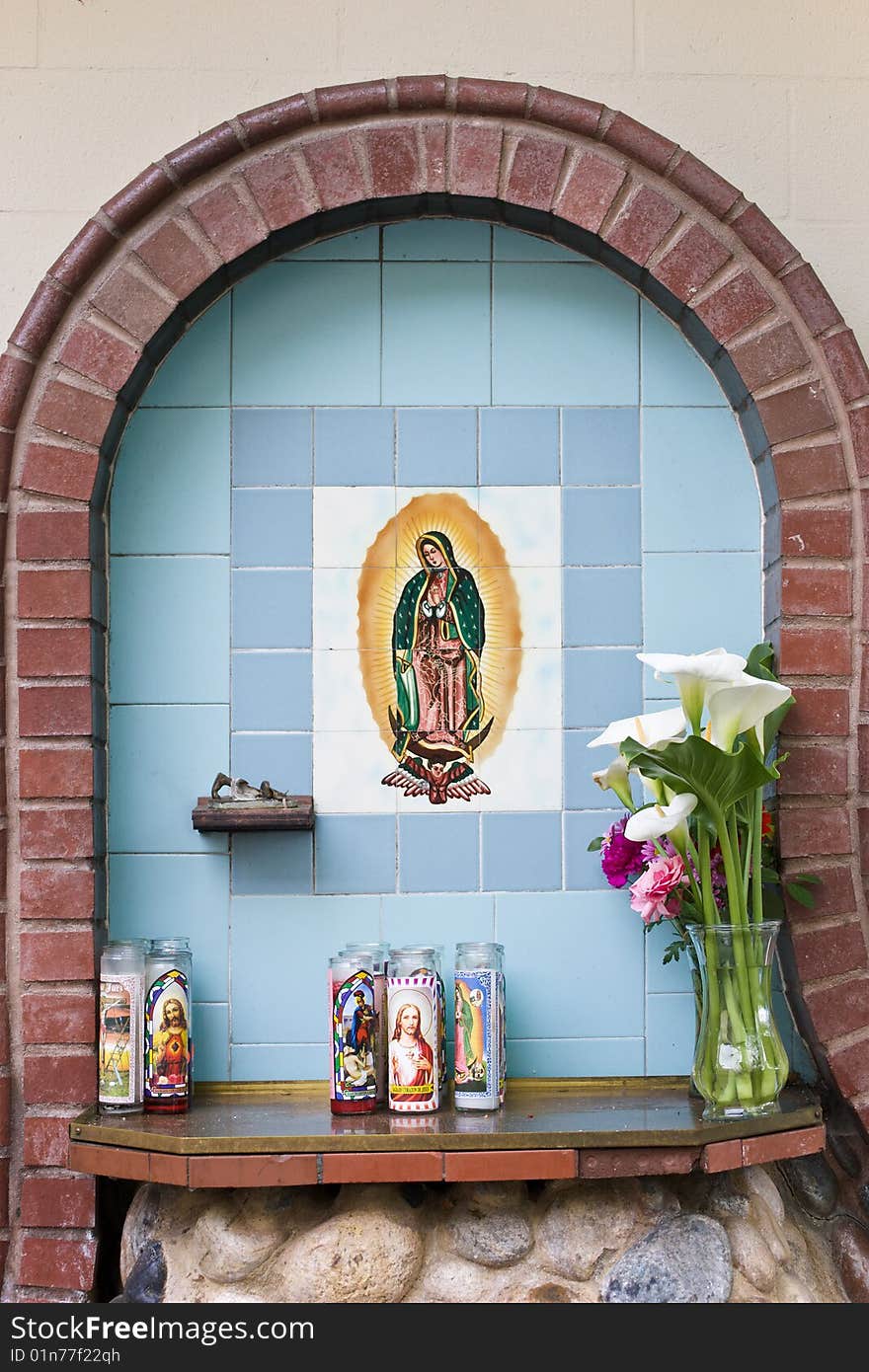 Rustic religious decoration in the courtyard of small town church