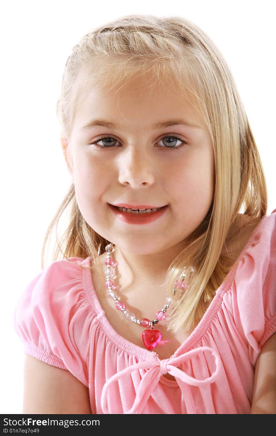 Cute little girl wearing a pink dress.