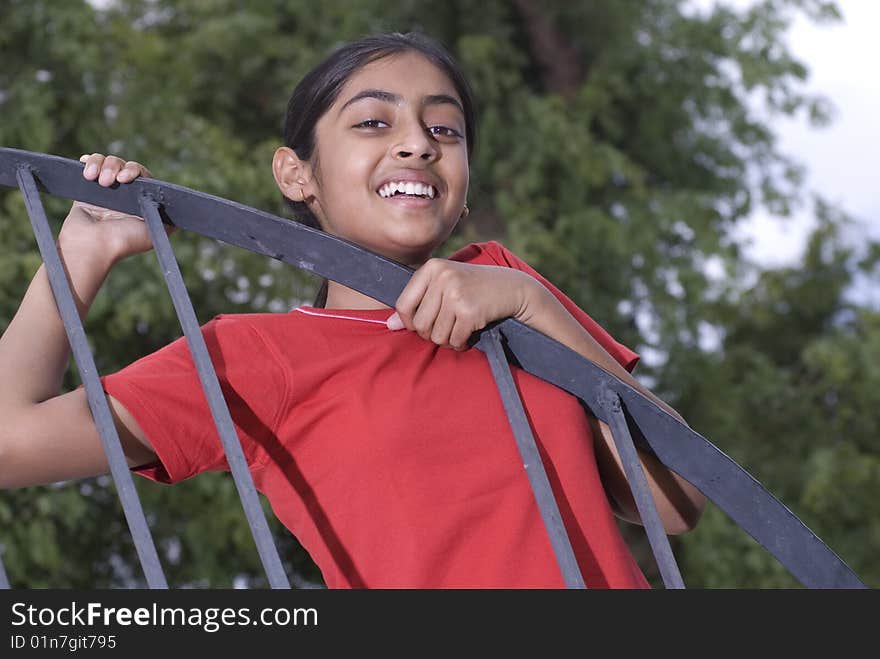 Girl looking from railing