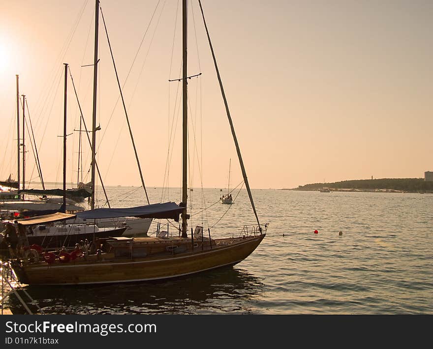 Marine yachts at a pier. Sunset soft lighting.