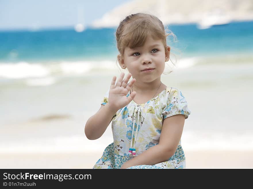 Portrait of nice little girl having fun on the beach. Portrait of nice little girl having fun on the beach