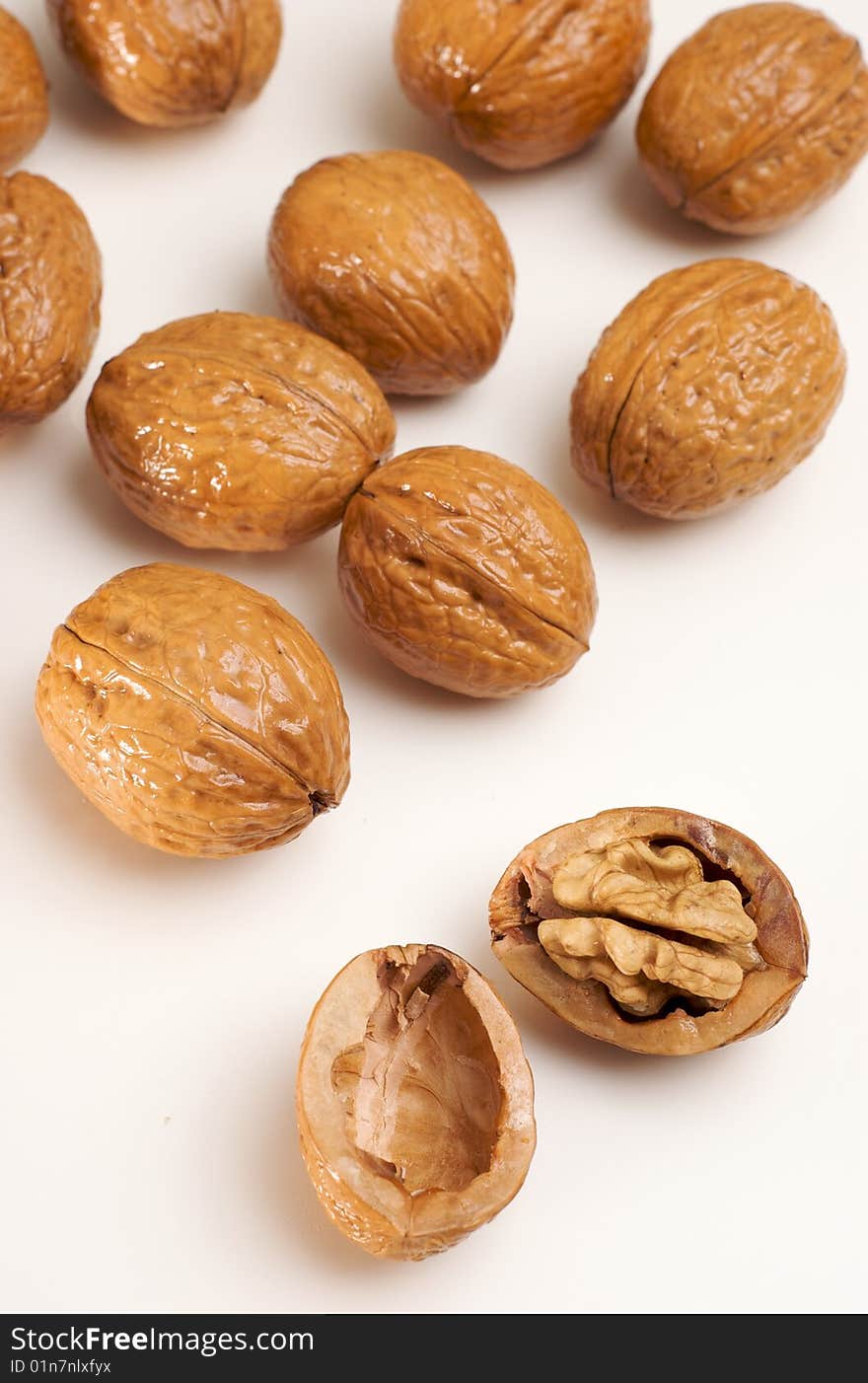 Walnuts isolated on white, one cracked