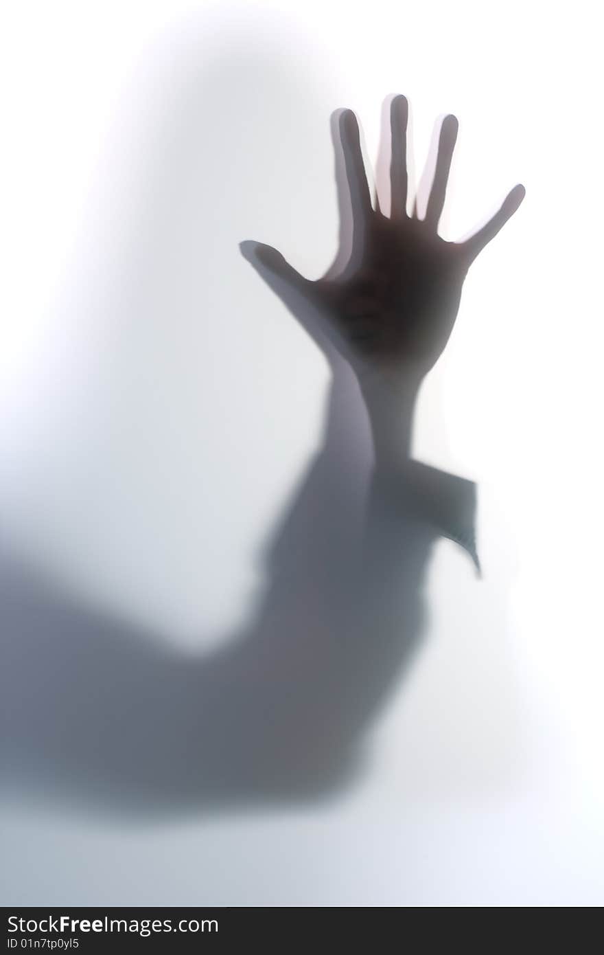 Diffused Silhouette of a womans body threw frosted glass