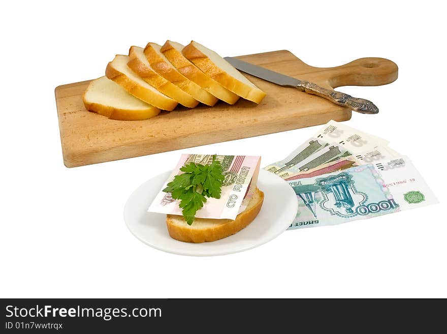 Hundred-ruble banknote and parsley leaves on a bread piece and other russian money near to a chopping board. Hundred-ruble banknote and parsley leaves on a bread piece and other russian money near to a chopping board