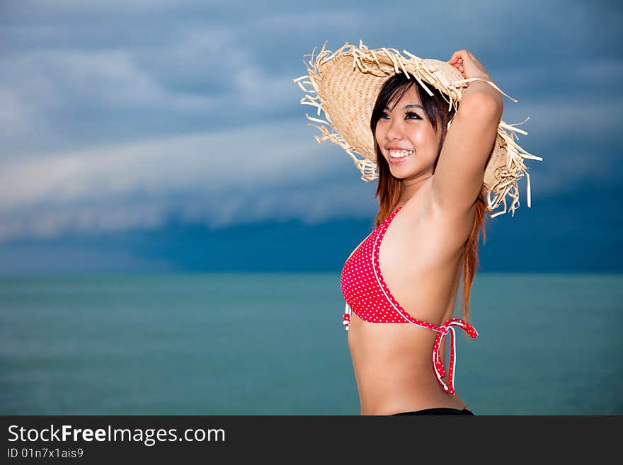 Happy young woman having fun by the beach. Happy young woman having fun by the beach