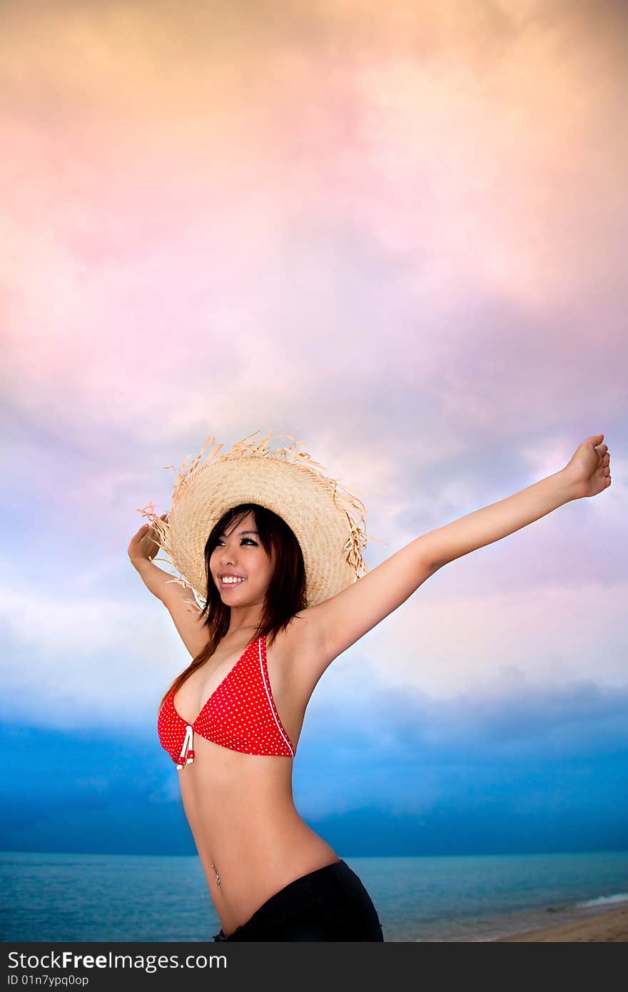 Happy young woman having fun by the beach. Happy young woman having fun by the beach