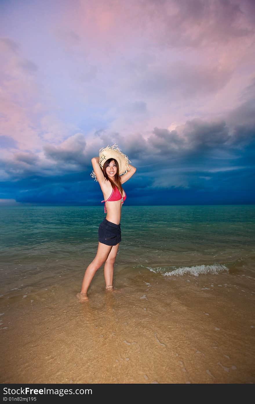 Happy young woman having fun by the beach. Happy young woman having fun by the beach