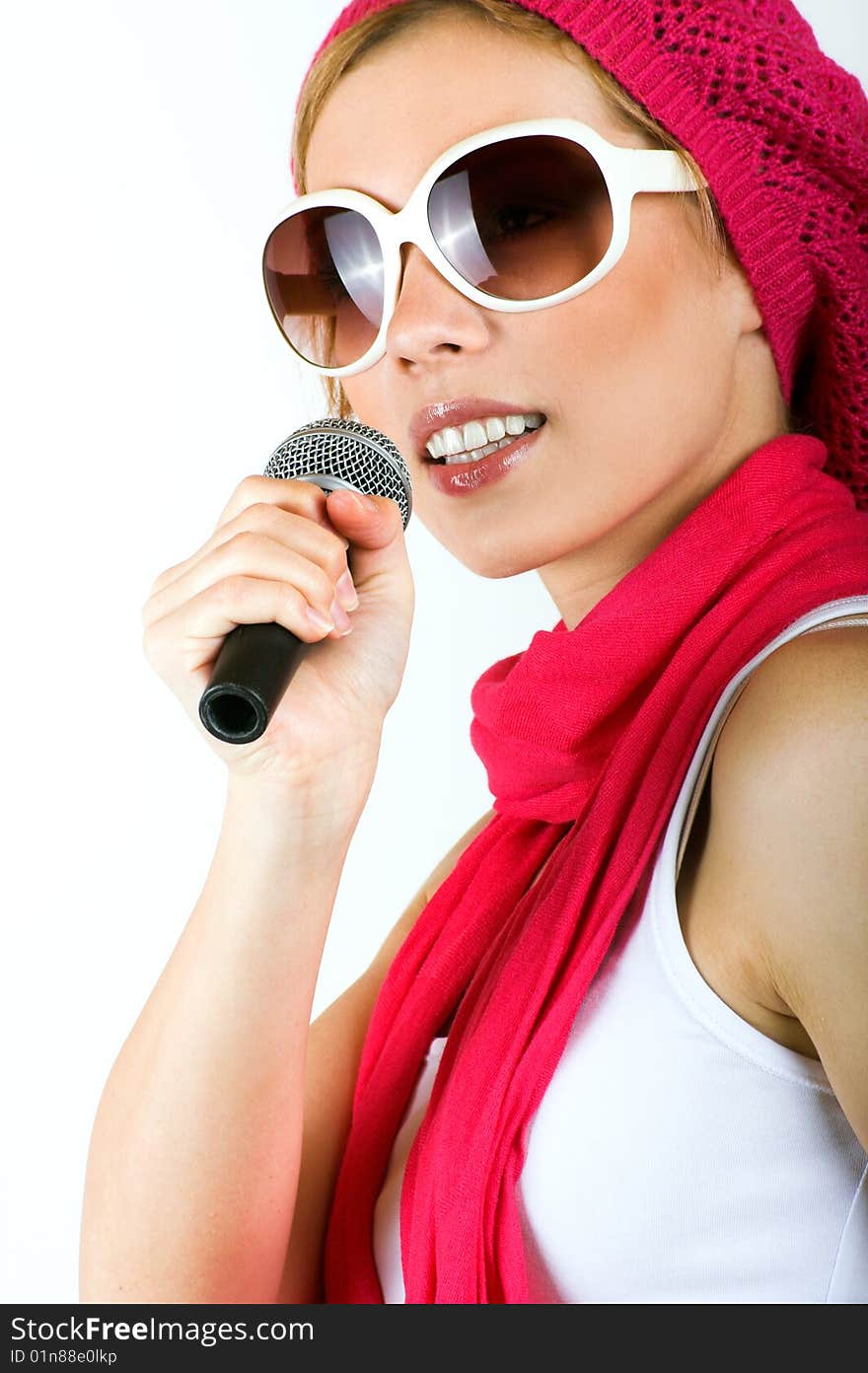 Portrait of a happy singing woman with a microphone. Portrait of a happy singing woman with a microphone