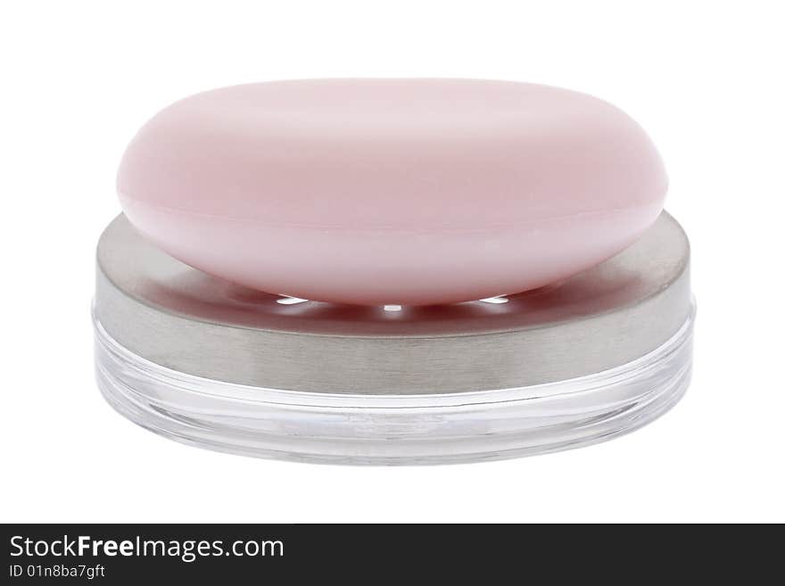 Pink soap with soap bowl, isolated against white background