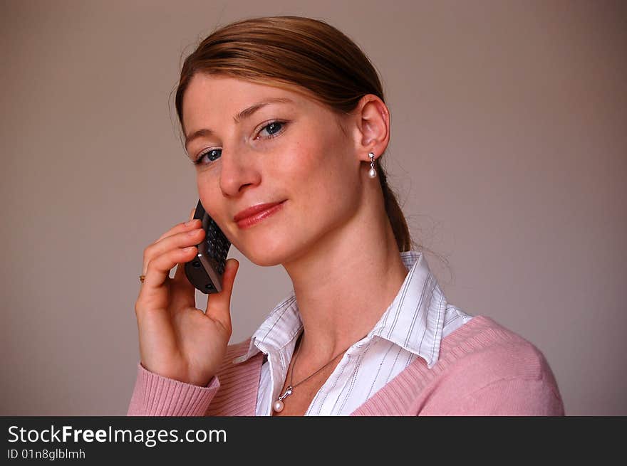 Young attractive woman at the phone. Young attractive woman at the phone