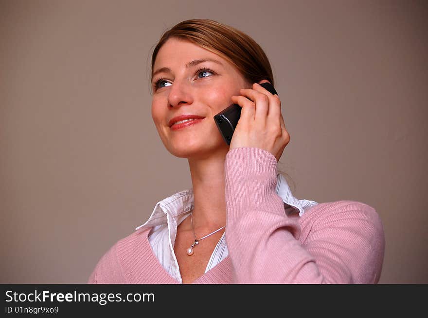 Young attractive woman at the phone. Young attractive woman at the phone