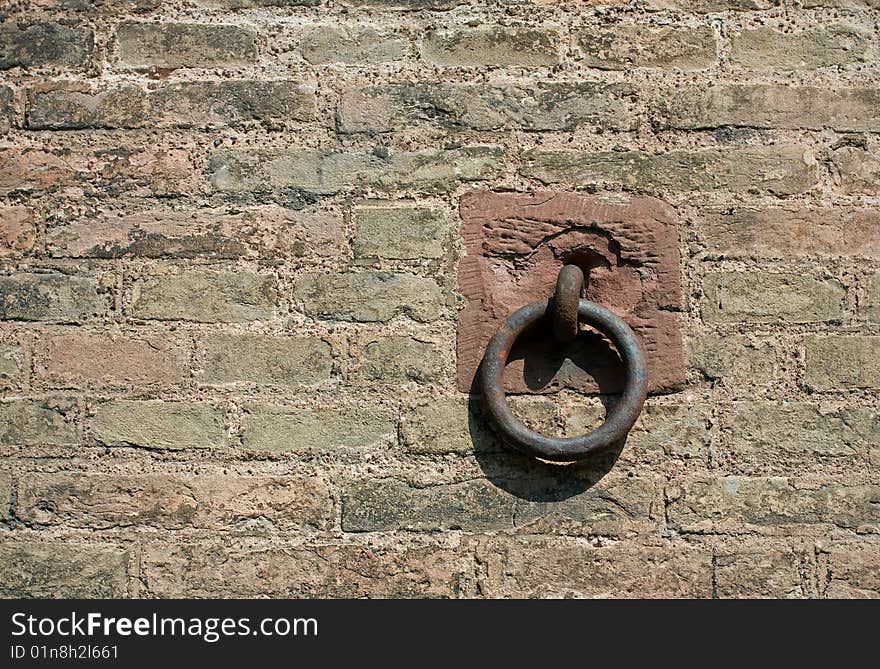 Rusty ring in the old brick wall