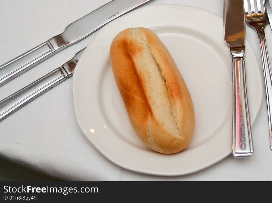 Bread on a plate with cutlery. Bread on a plate with cutlery