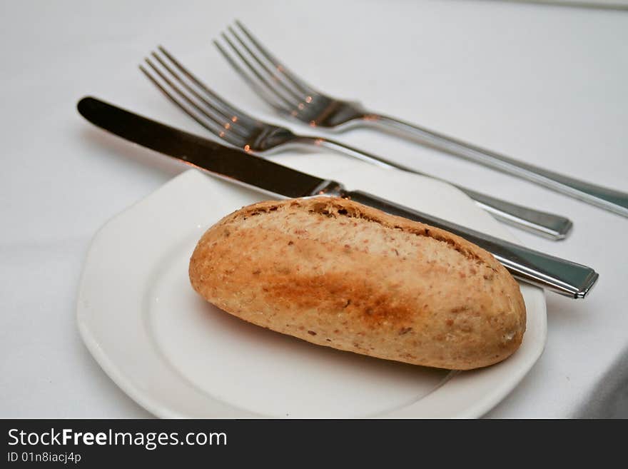 Bread on a plate with cutlery. Bread on a plate with cutlery