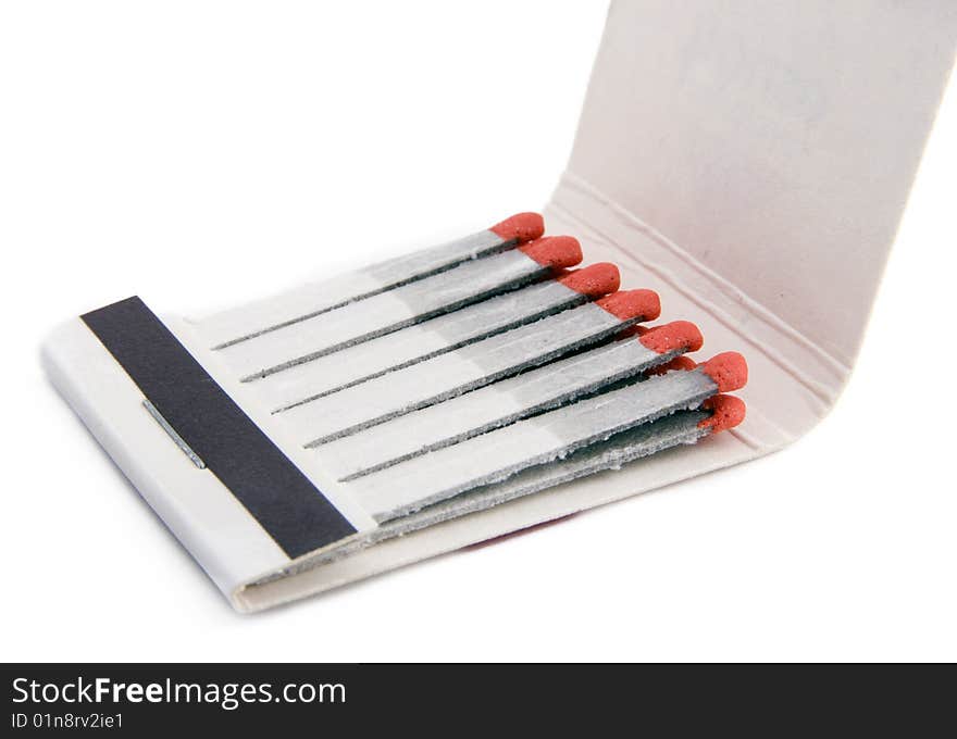 Matches and matchbox on a white background