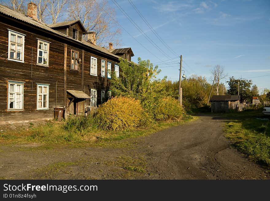 Old house at the sunny autumn day in a village