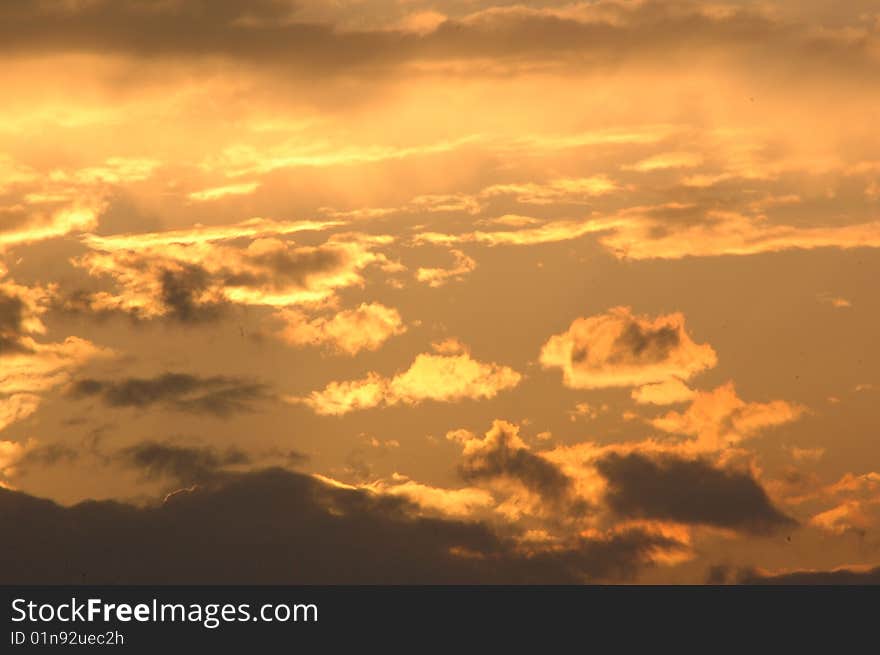 Sunset on the background of clouds