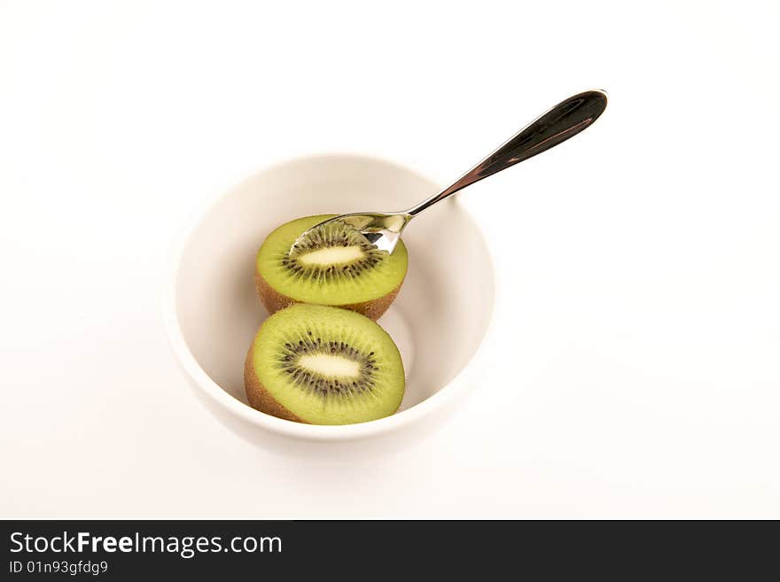 Kiwi, bowl and spoon