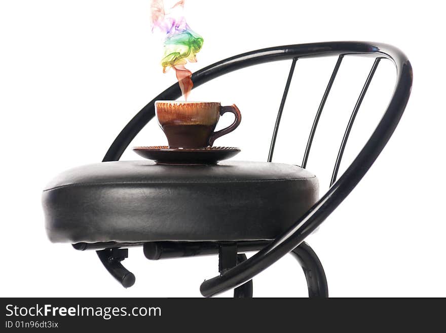 Coffee cup on a bar chair with a colour smoke. Isolated over white. Coffee cup on a bar chair with a colour smoke. Isolated over white.