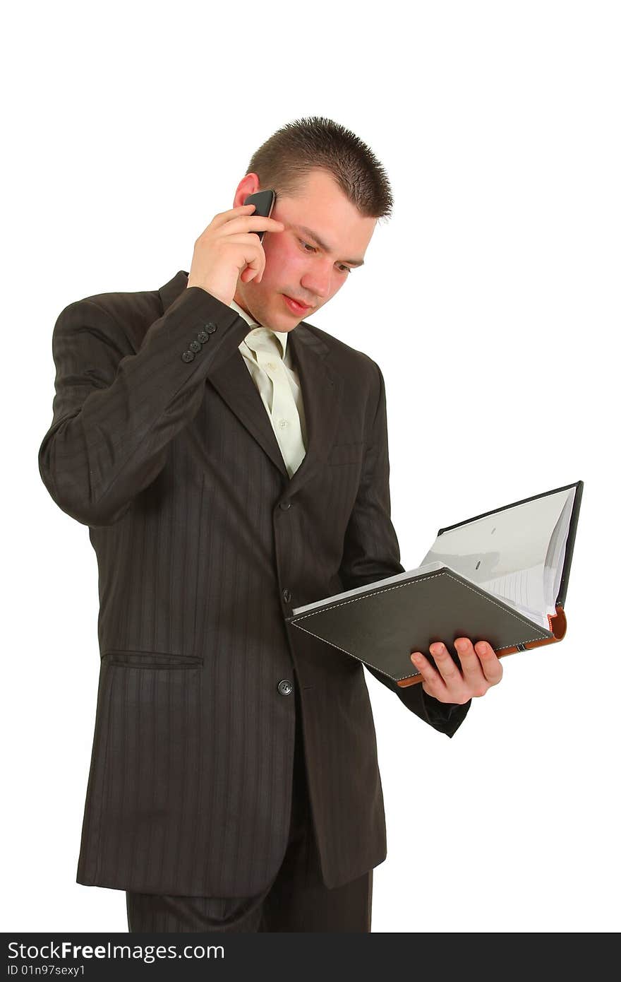 Businessman calling on cellphone, smiling