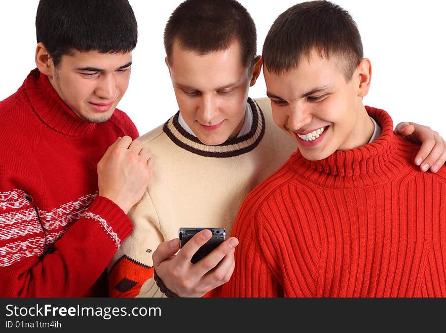 Three friends look on handheld computer on white