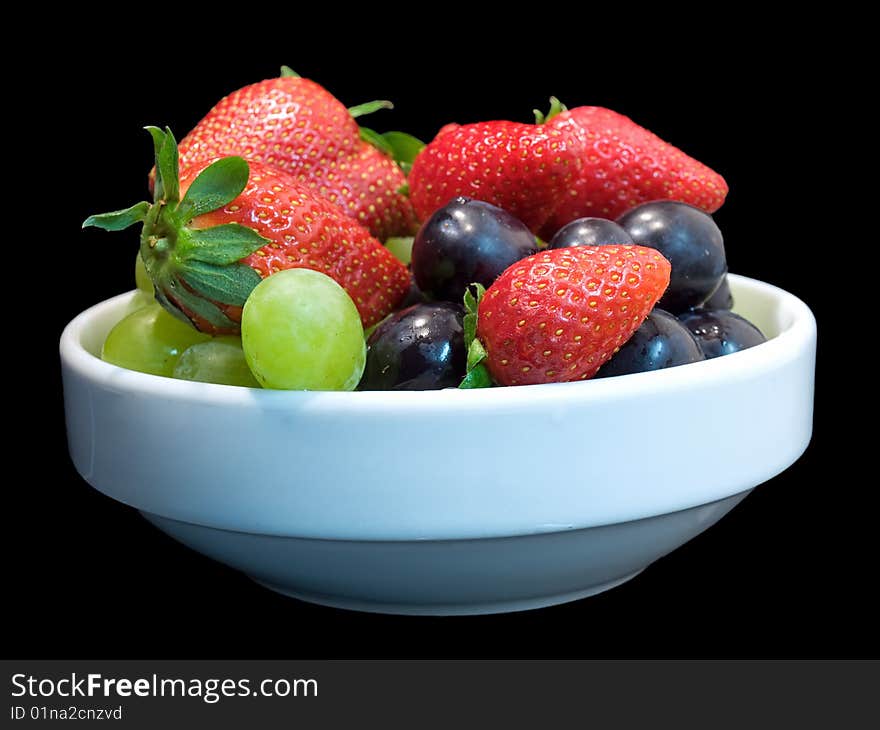 Some fruits isolated on a black background. Some fruits isolated on a black background.