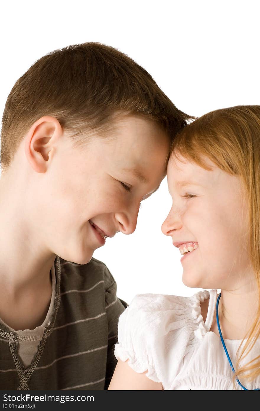 Happy brother and sister isolated on white