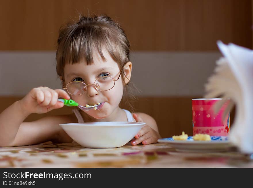 Little girl dinning in room. Little girl dinning in room