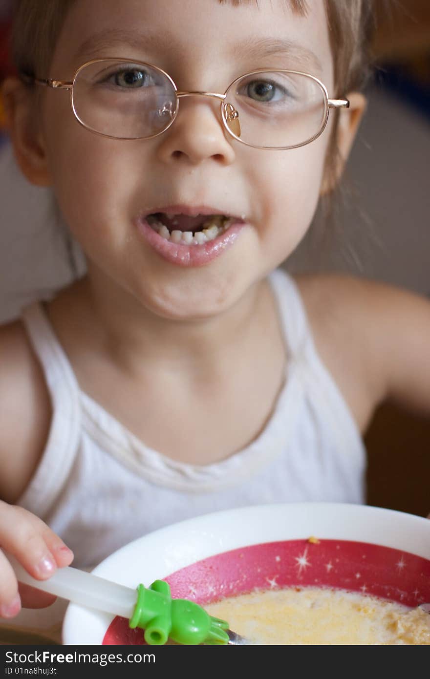 Little girl dinning in room. Little girl dinning in room