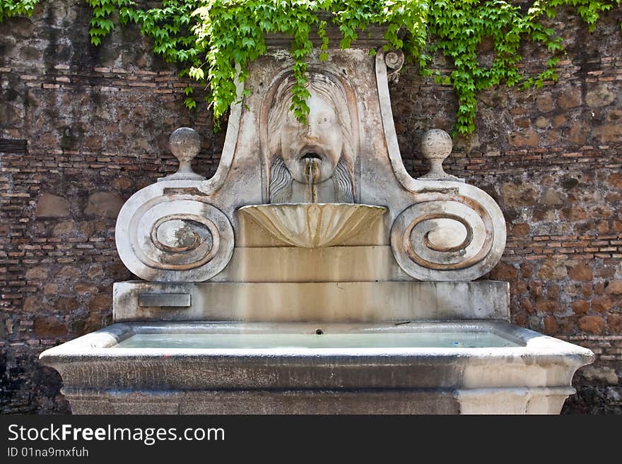 Old fountain in Trastevere in Rome