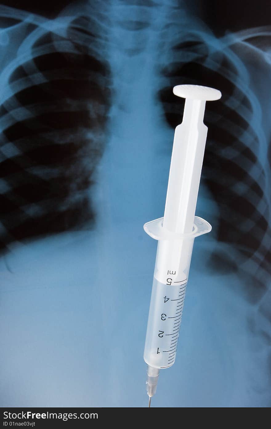 Syringe on baby x-ray background