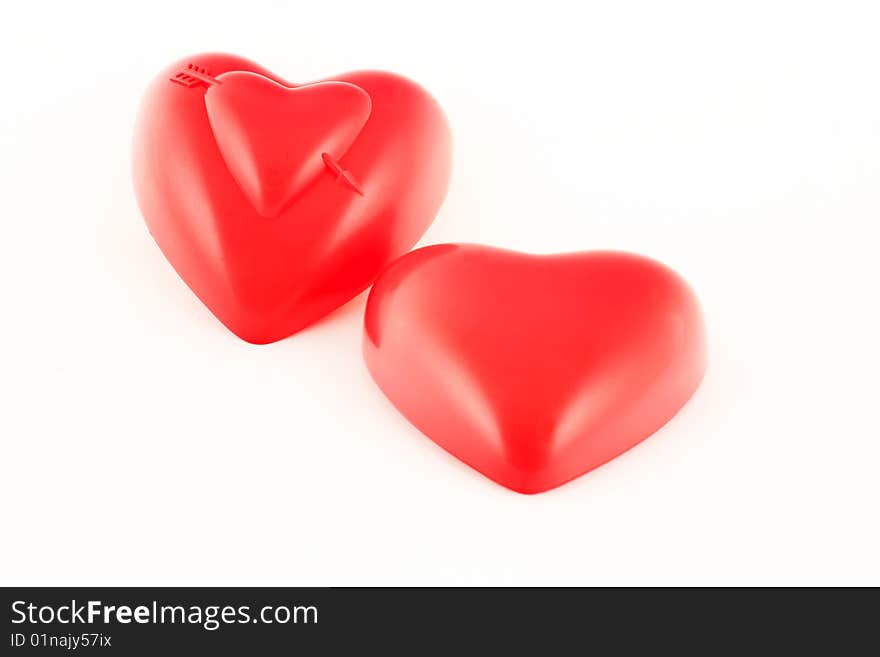 Two hearts standing and lying showing togetherness concept. Two hearts standing and lying showing togetherness concept