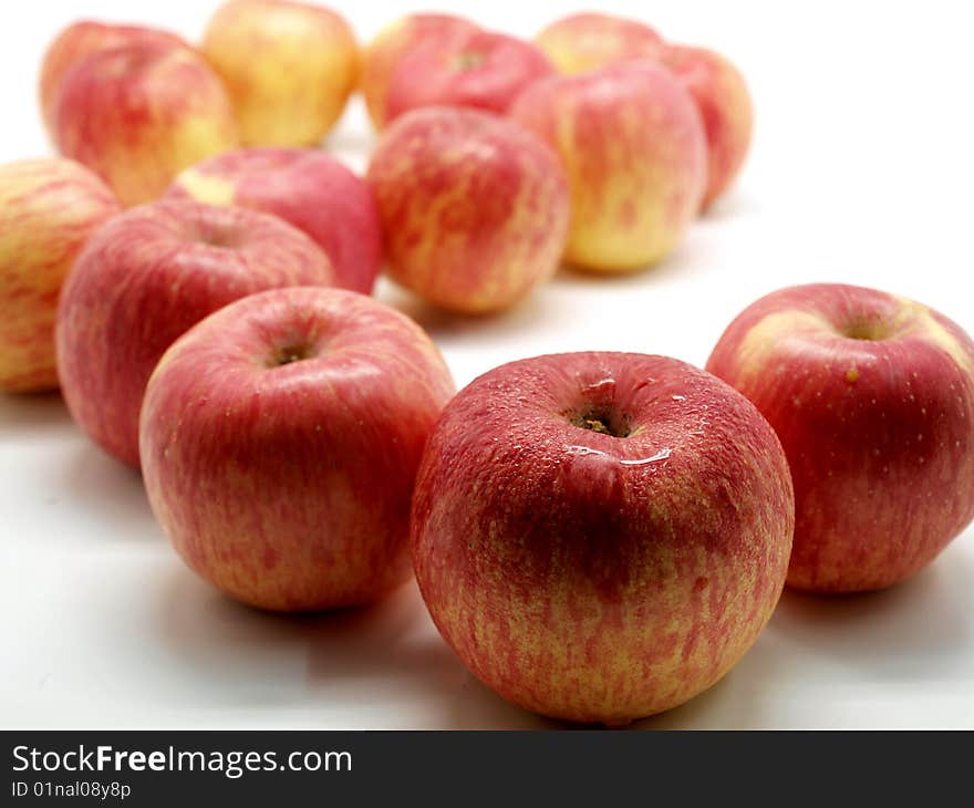 Red apples with water drops isolated on white background. Red apples with water drops isolated on white background.