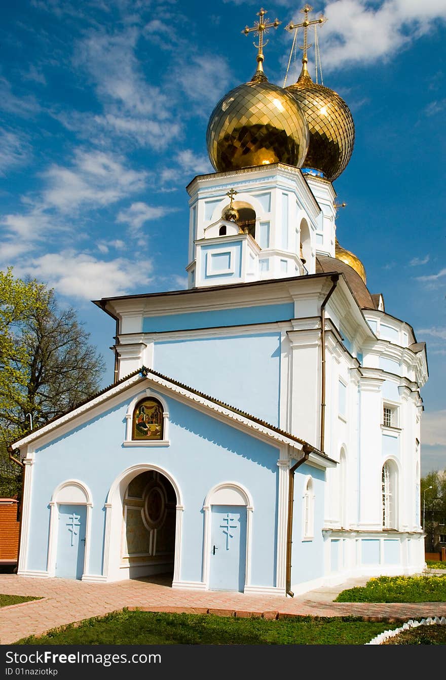 The Christian orthodox temple on background of blue sky. The Christian orthodox temple on background of blue sky