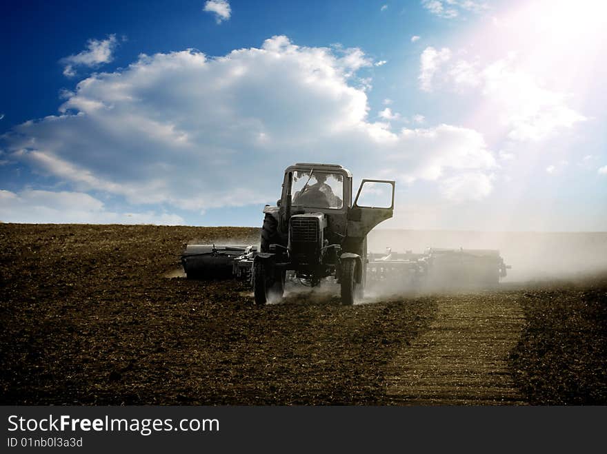 The tractor ploughs a field