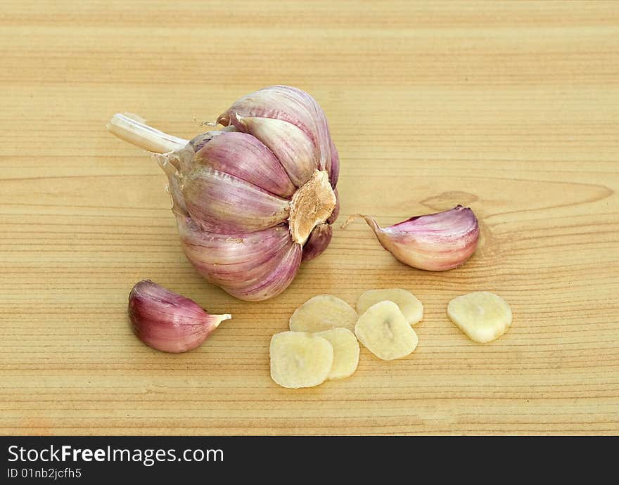 Garlic and cloves on desk