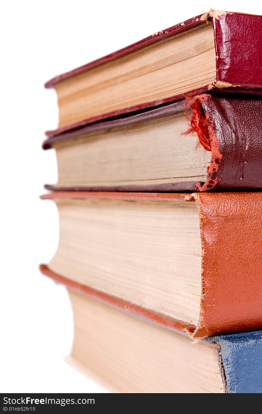 Row of old books isolated on white background.